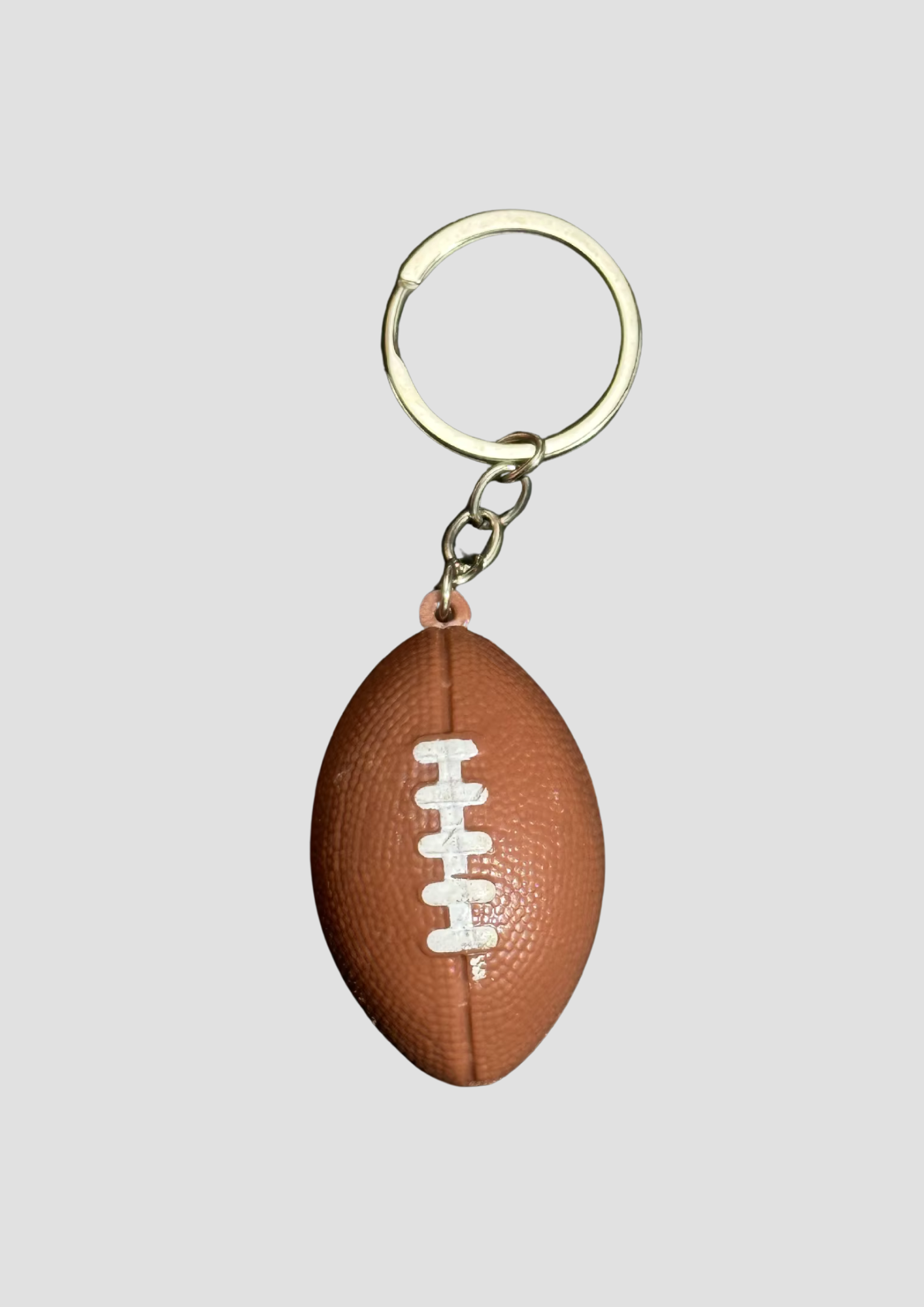 American Football charm – sporty bag charm shaped like a football, perfect for bold styling