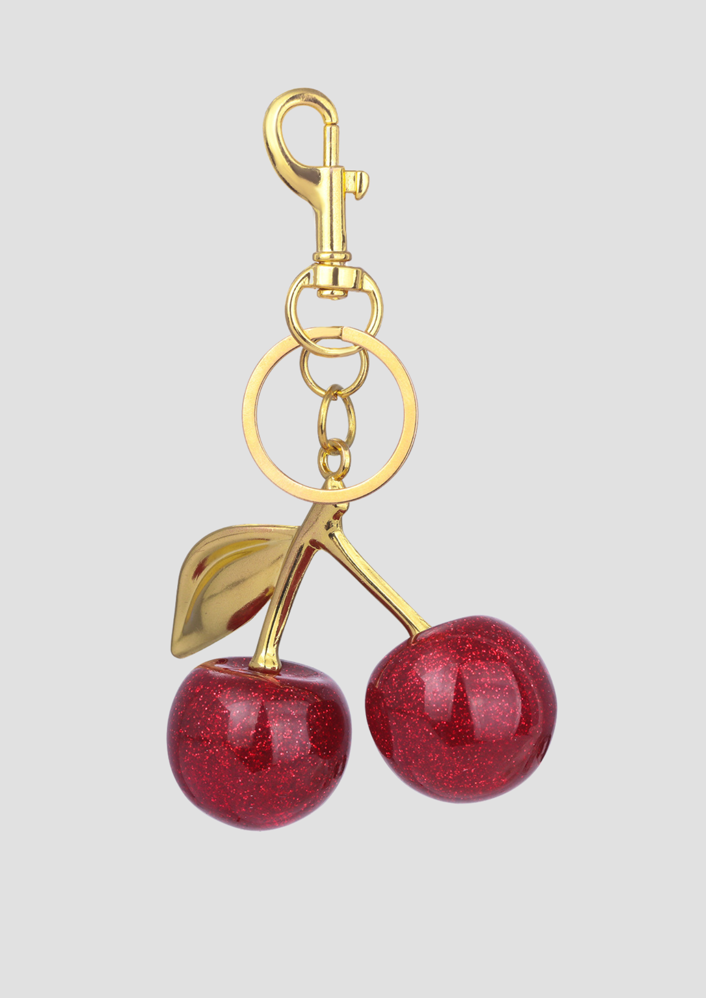Cherry bag charm – gold and red cherry charm from Ronja Studio for a sweet, stylish look